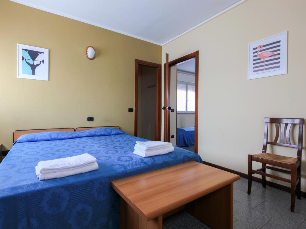 Łóżko lub łóżka w pokoju w obiekcie Locanda La Castellana