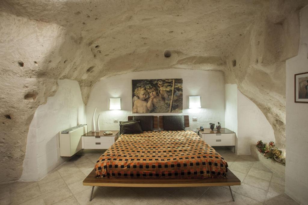 A bed or beds in a room at Residence San Pietro Barisano