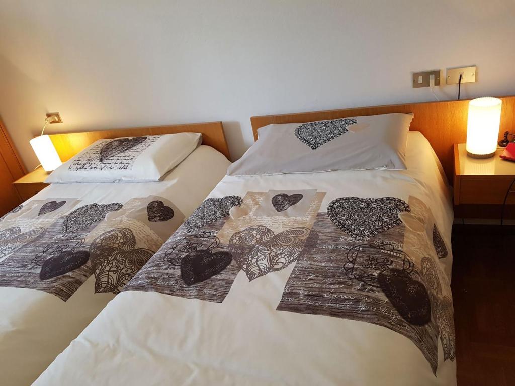 Postel nebo postele na pokoji v ubytování Albergo Posta