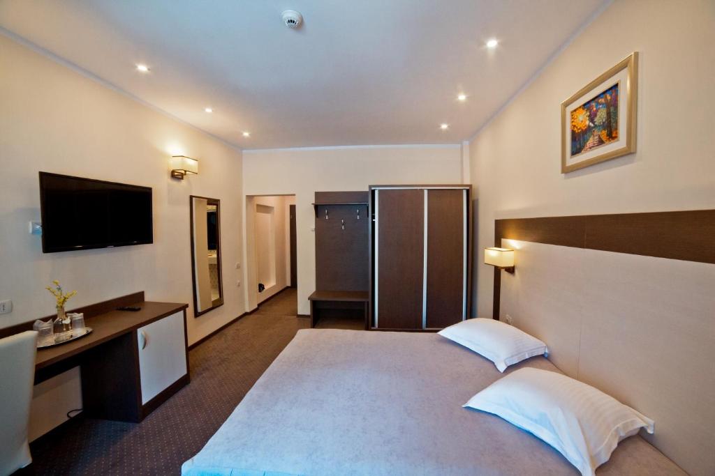 Postel nebo postele na pokoji v ubytování Hotel Evergreen