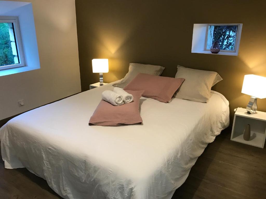 Postel nebo postele na pokoji v ubytování Les Mandarins