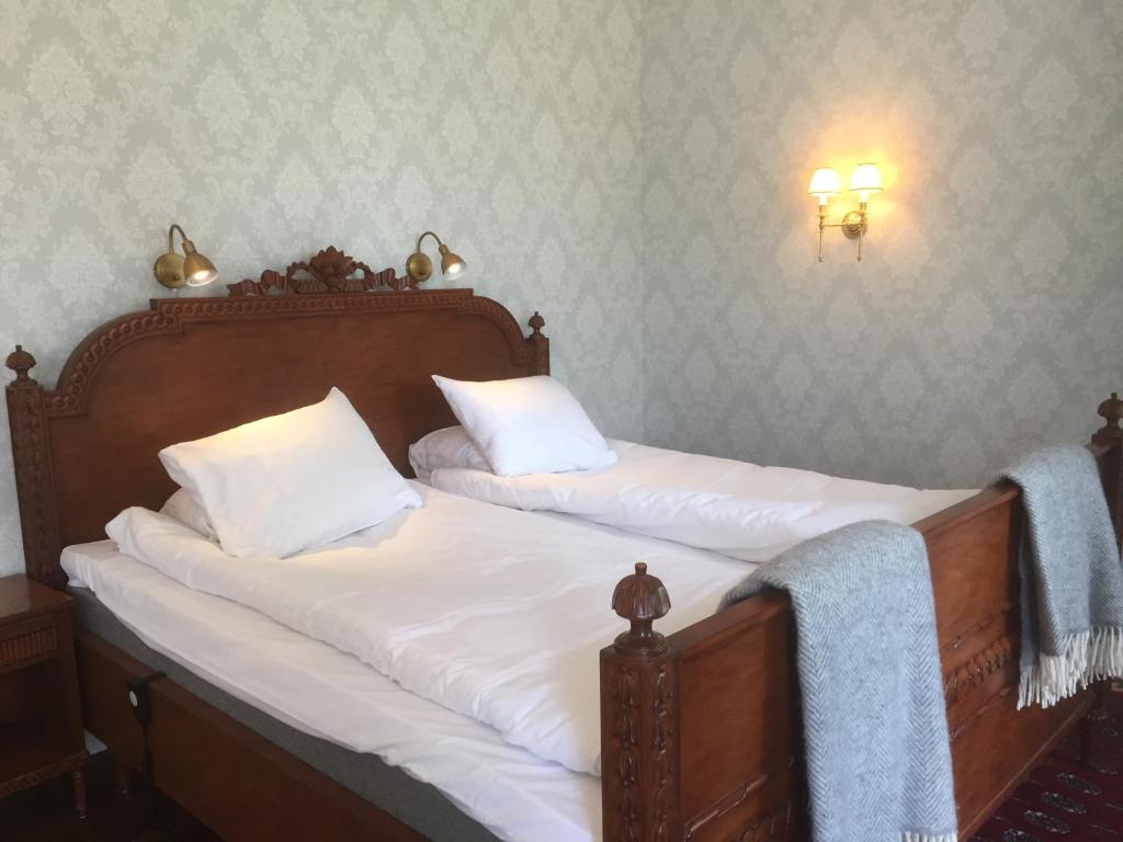 Postel nebo postele na pokoji v ubytování Kastanjelund