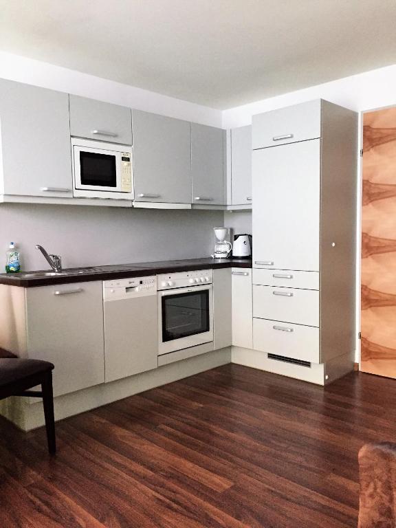Kuchyňa alebo kuchynka v ubytovaní Almandin Apartments