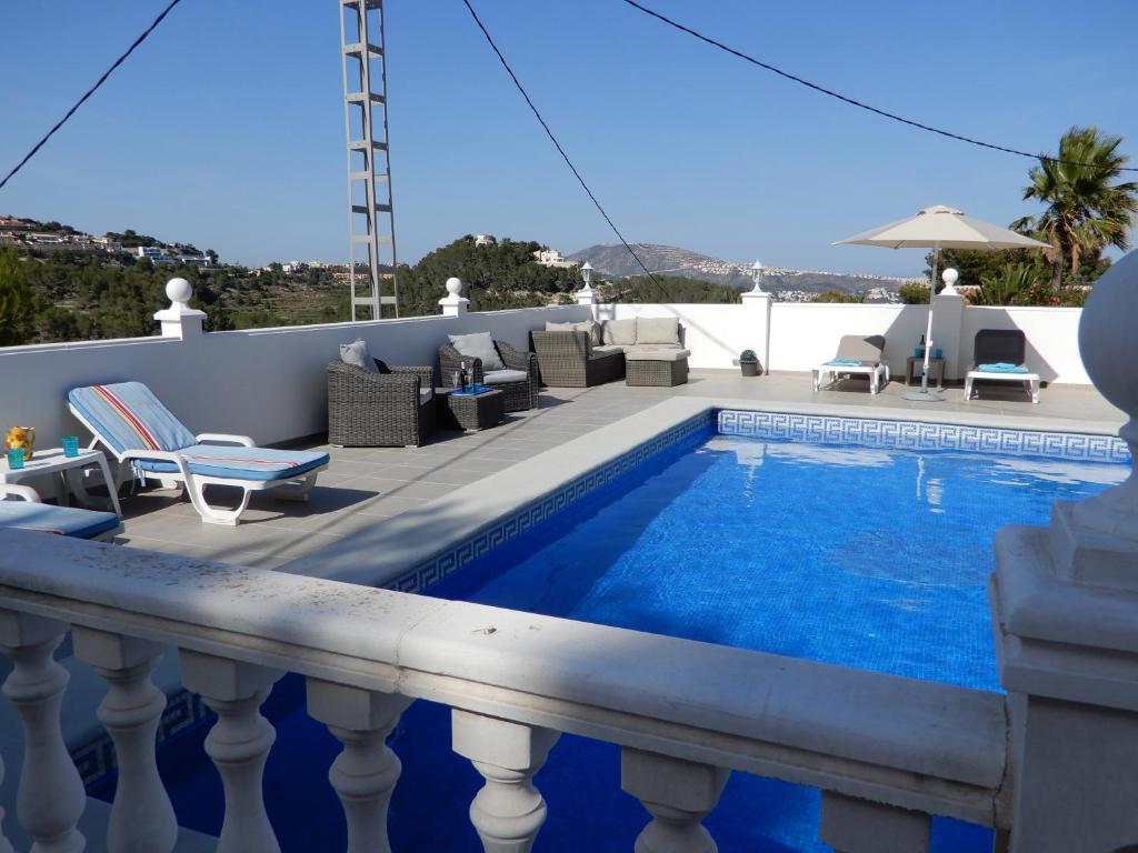 a pool on the balcony of a house at Villa Amare in Benissa