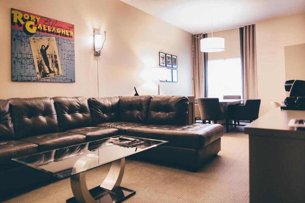 a living room filled with furniture and a coffee table at JAG Boutique Hotel in St. John's