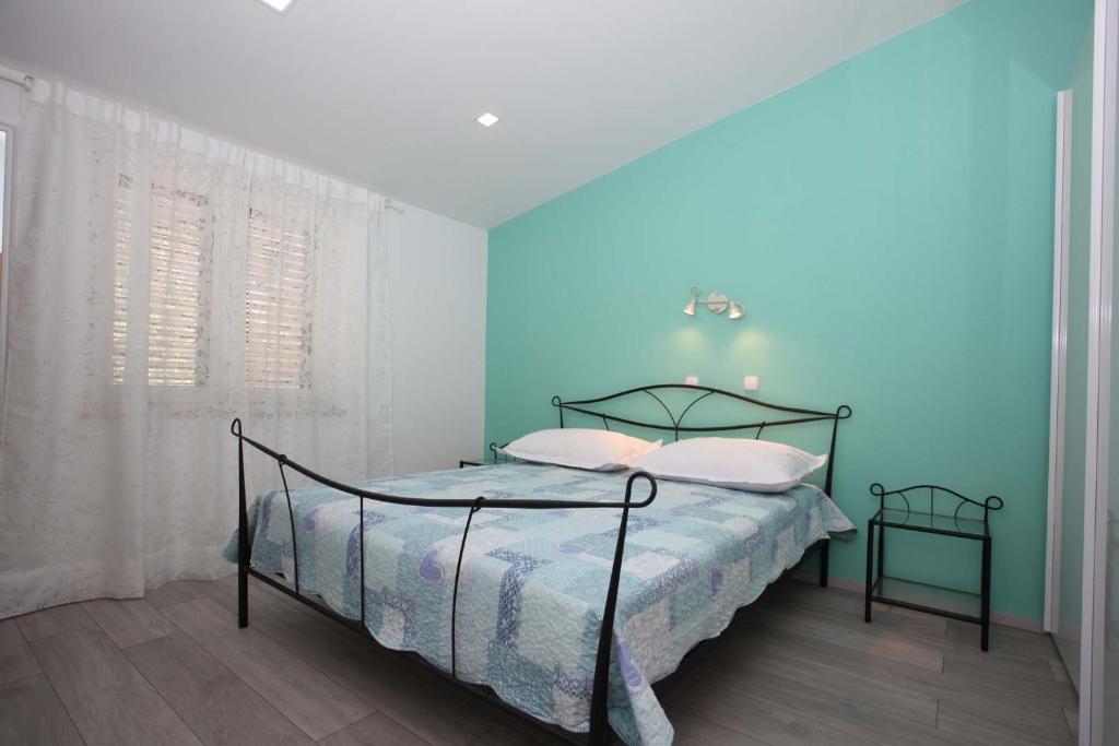Postel nebo postele na pokoji v ubytování Apartman Josipa