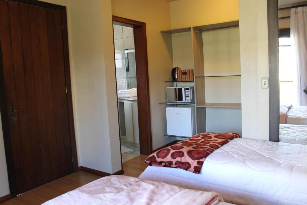 Kuchyň nebo kuchyňský kout v ubytování Residencial Aconchego do Lago