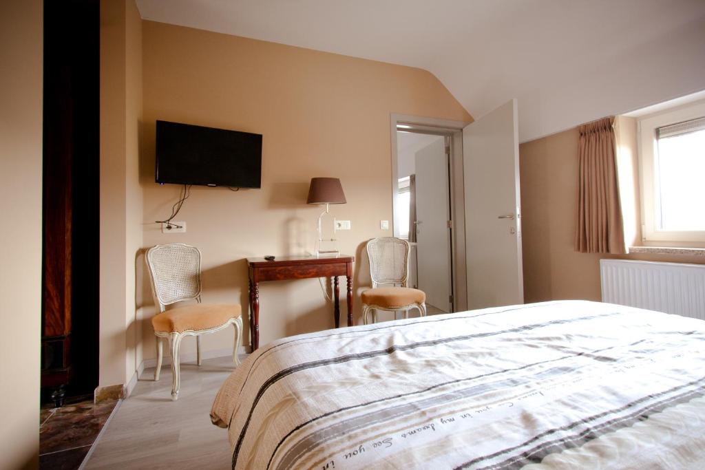 Postel nebo postele na pokoji v ubytování Shangrilaherzele