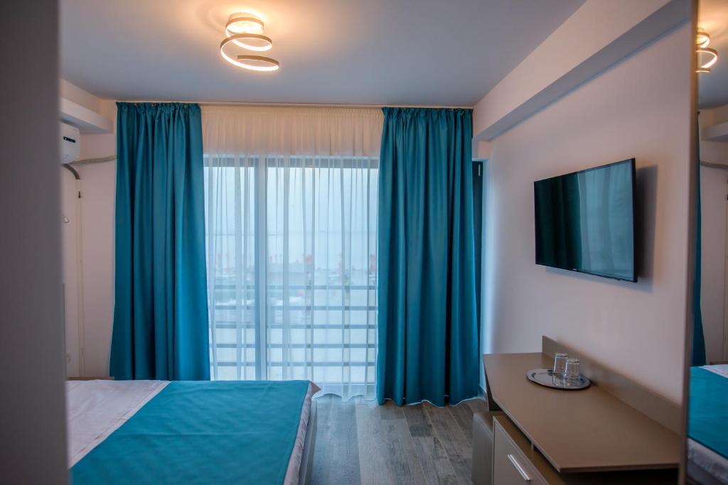 Postel nebo postele na pokoji v ubytování Belleview Suites