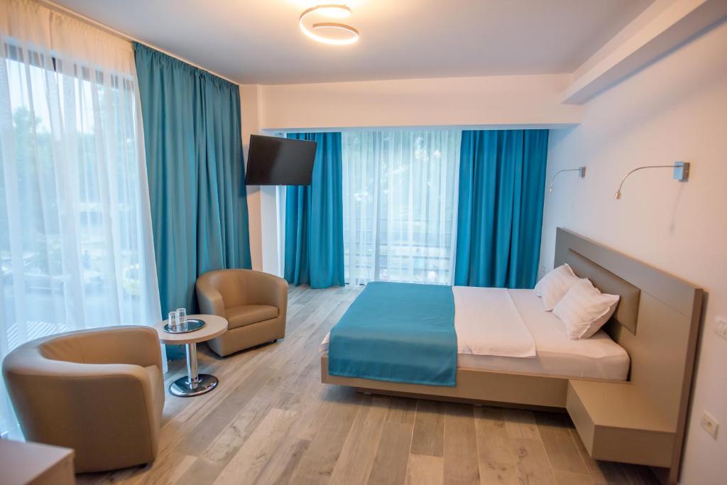 Postel nebo postele na pokoji v ubytování Belleview Suites
