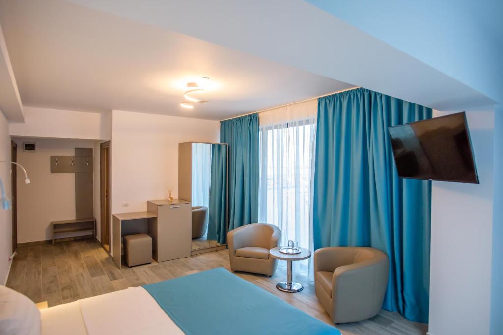 TV a/nebo společenská místnost v ubytování Belleview Suites