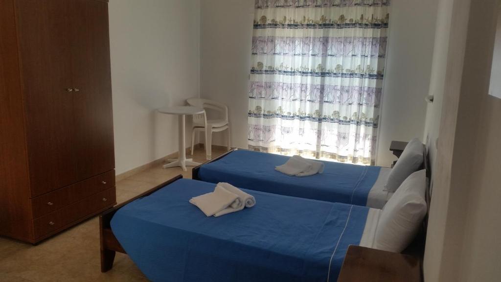 Posteľ alebo postele v izbe v ubytovaní Stelios studios