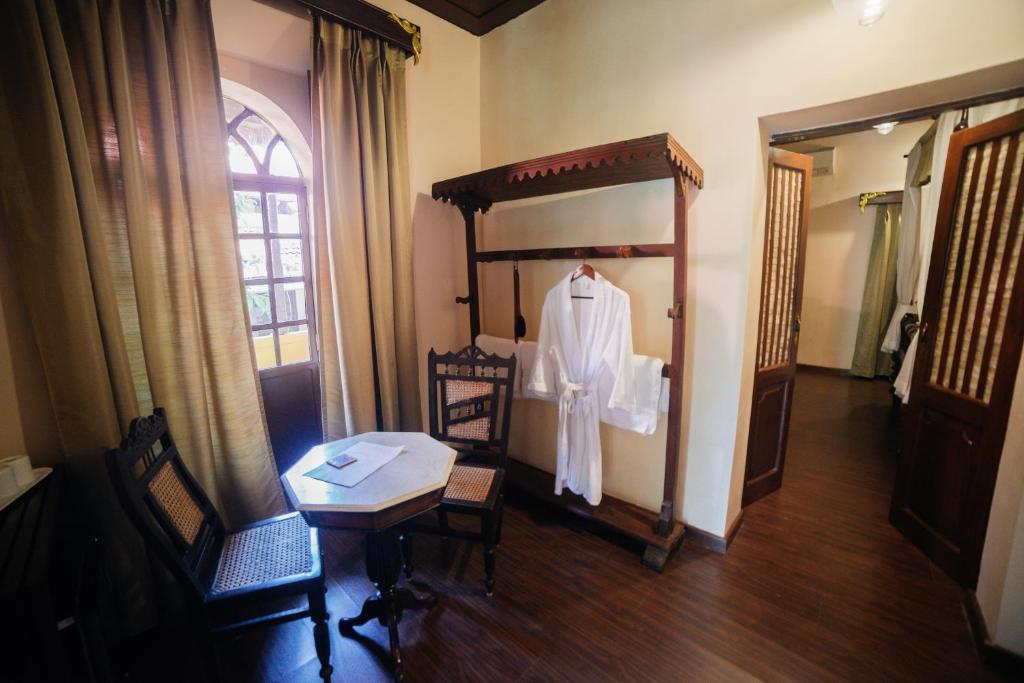 Postel nebo postele na pokoji v ubytování Casa Menezes - A Heritage Goan Homestay