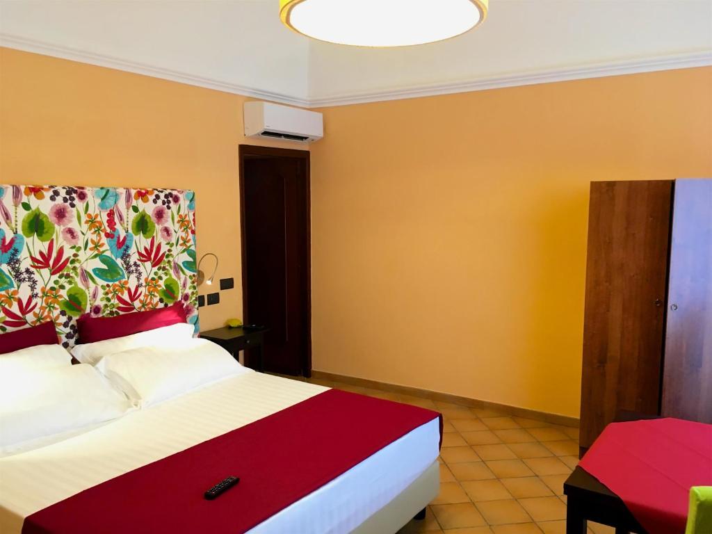 Postel nebo postele na pokoji v ubytování Residenza Viviani