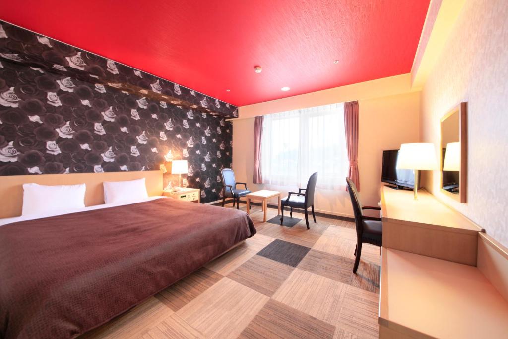 Postel nebo postele na pokoji v ubytování Quintessa Hotel Iseshima