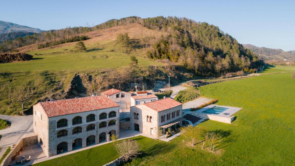 an aerial view of a large building on a hill at Les Planes del Grau in Sant Joan de les Abadesses