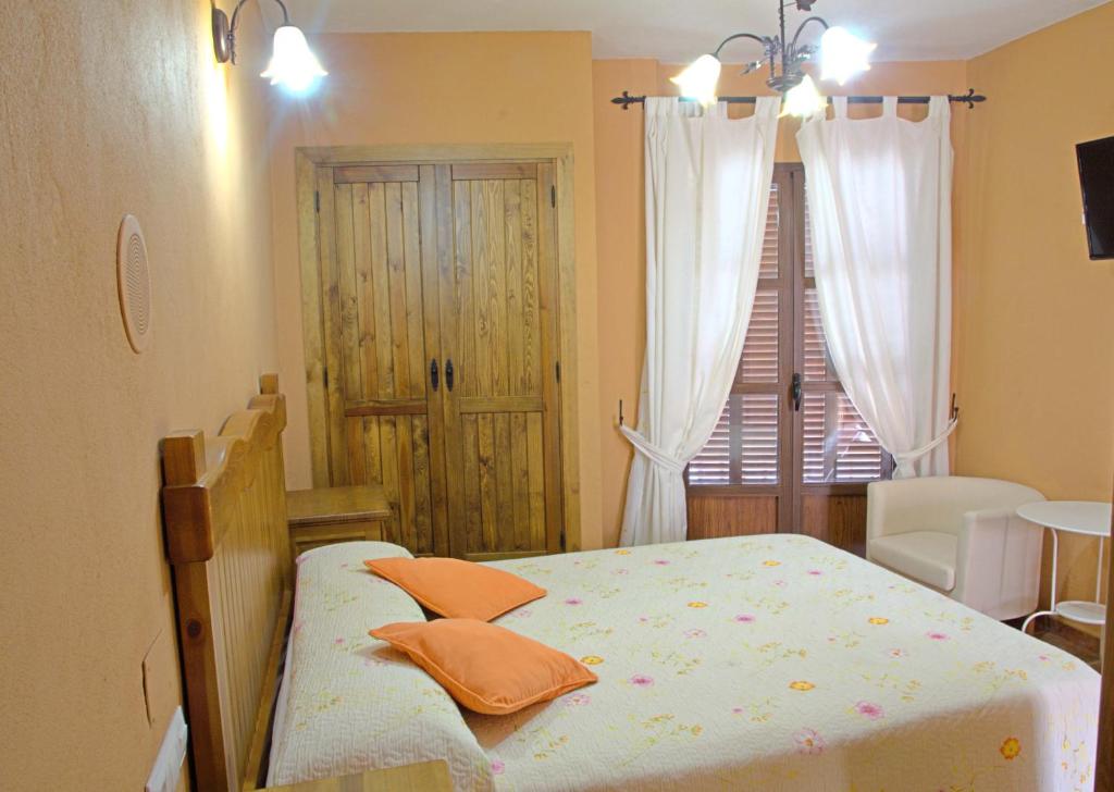 Posteľ alebo postele v izbe v ubytovaní Hotel Posada Casas Viejas