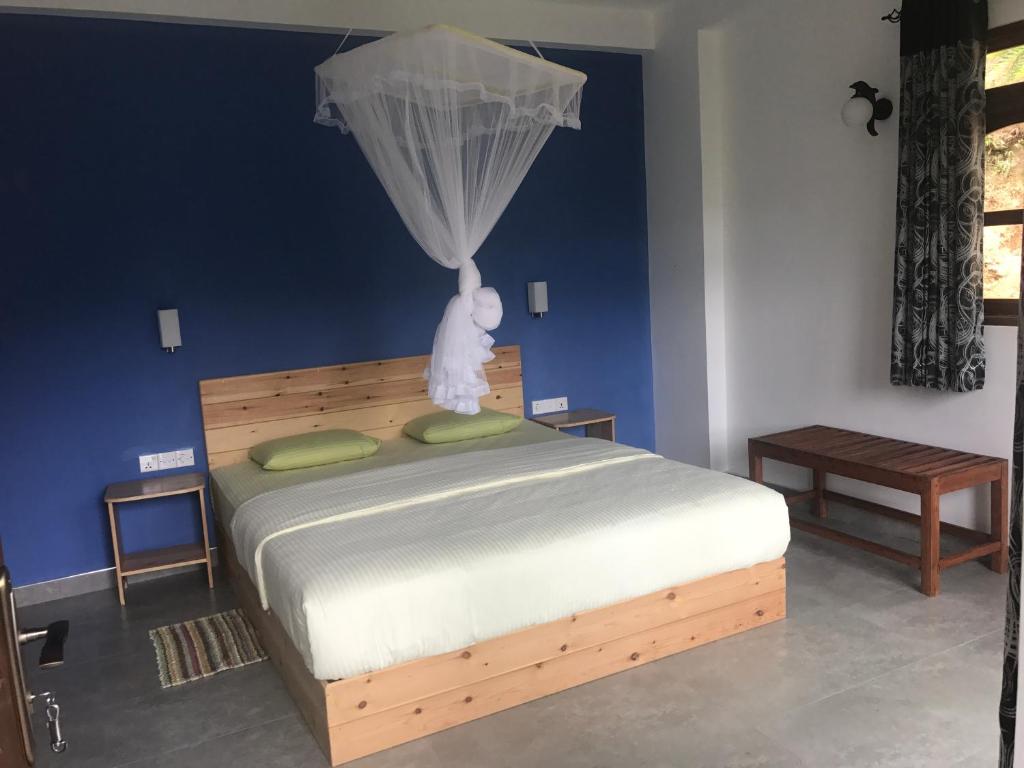 Postel nebo postele na pokoji v ubytování Raveena Guest House