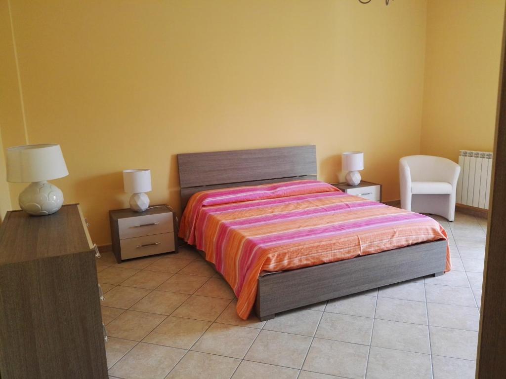 Łóżko lub łóżka w pokoju w obiekcie Casa Catena