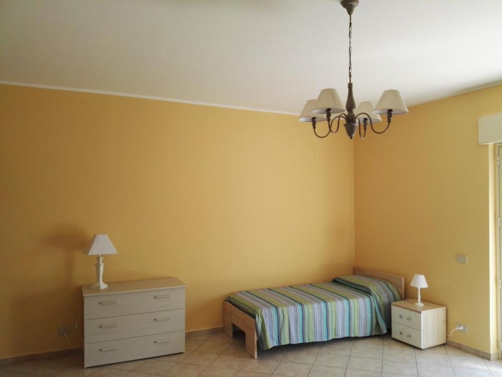 Łóżko lub łóżka w pokoju w obiekcie Casa Catena