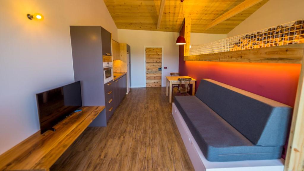 Televízia a/alebo spoločenská miestnosť v ubytovaní Casa Rural Cal Rossa de Taus SPA