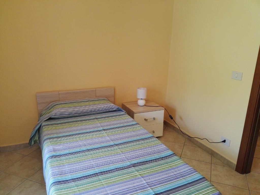 Łóżko lub łóżka w pokoju w obiekcie Casa Catena
