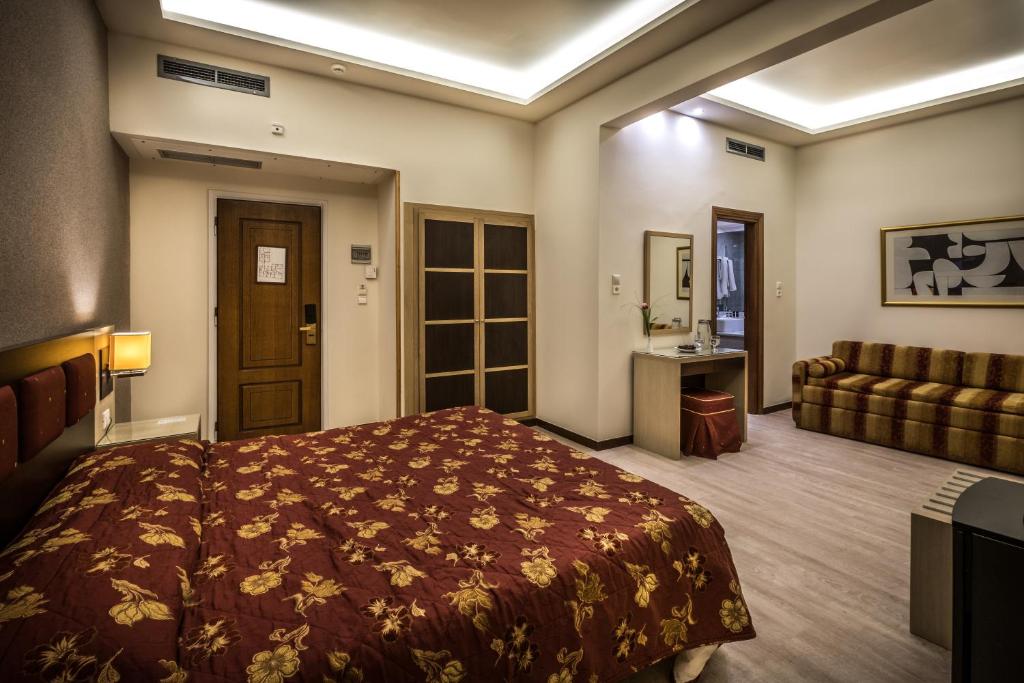 Postel nebo postele na pokoji v ubytování Rex Hotel