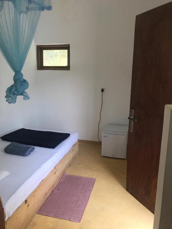 Postel nebo postele na pokoji v ubytování Raveena Guest House