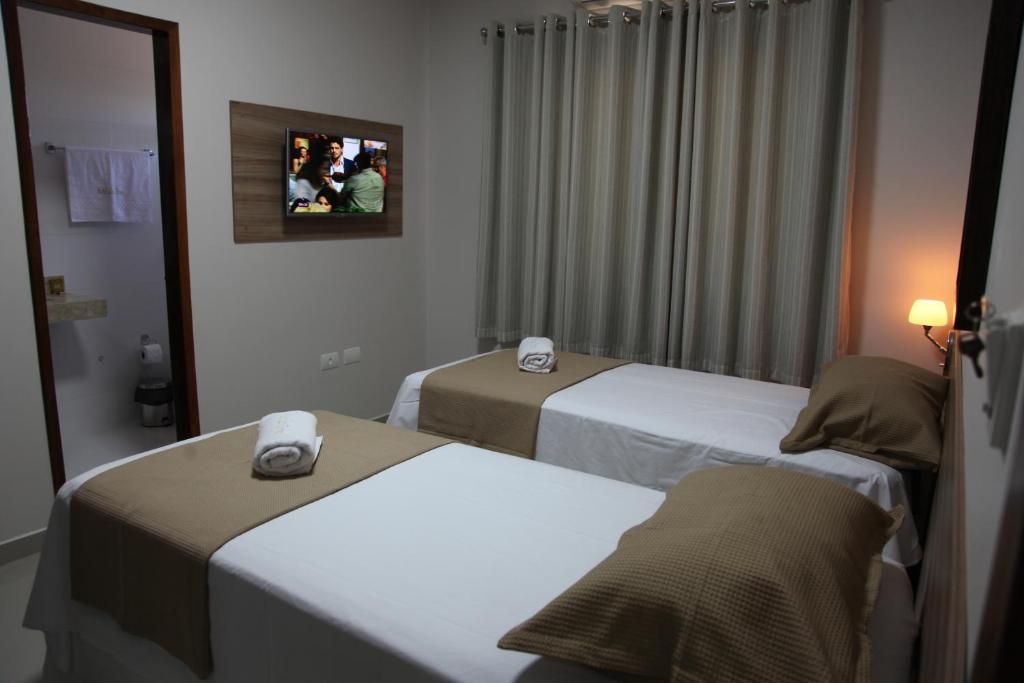 Postel nebo postele na pokoji v ubytování Hotel das Torres