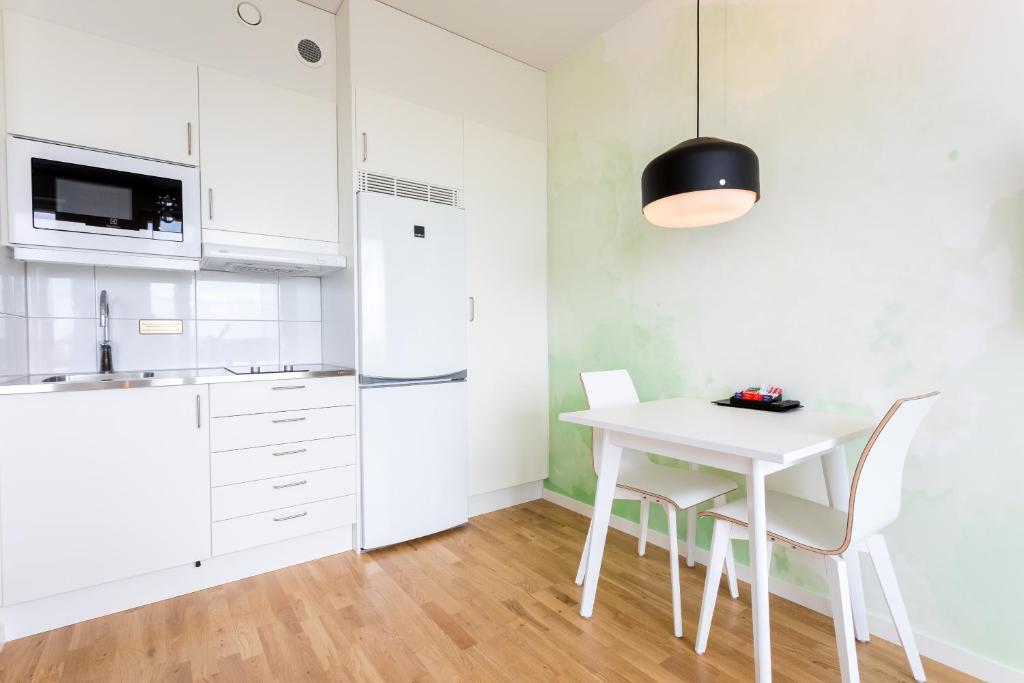 Kuchyň nebo kuchyňský kout v ubytování ApartDirect Älvsjö
