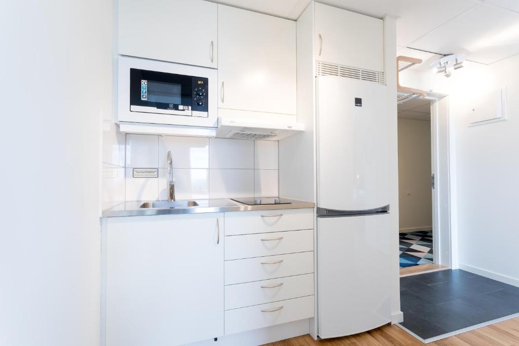 Kuchyň nebo kuchyňský kout v ubytování ApartDirect Älvsjö