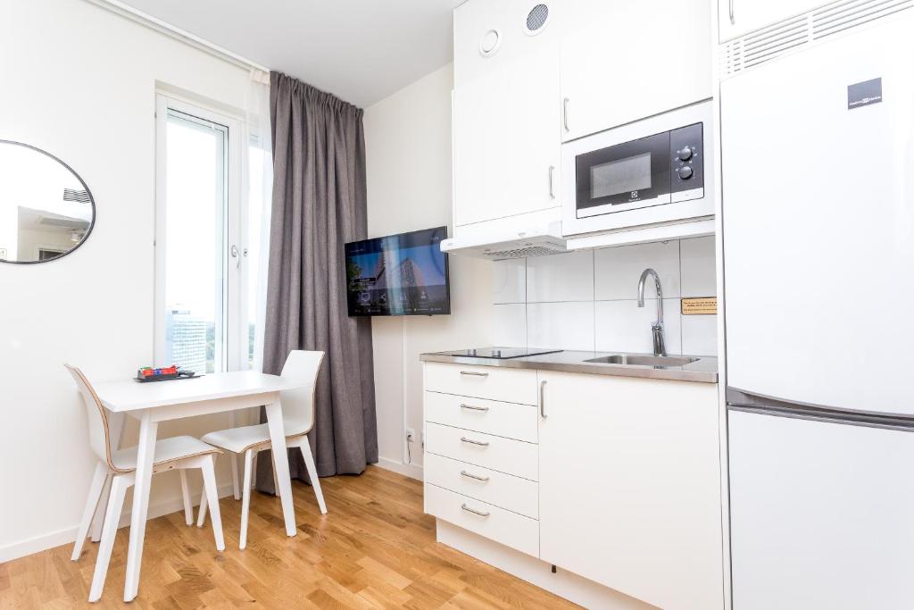 Kuchyň nebo kuchyňský kout v ubytování ApartDirect Älvsjö