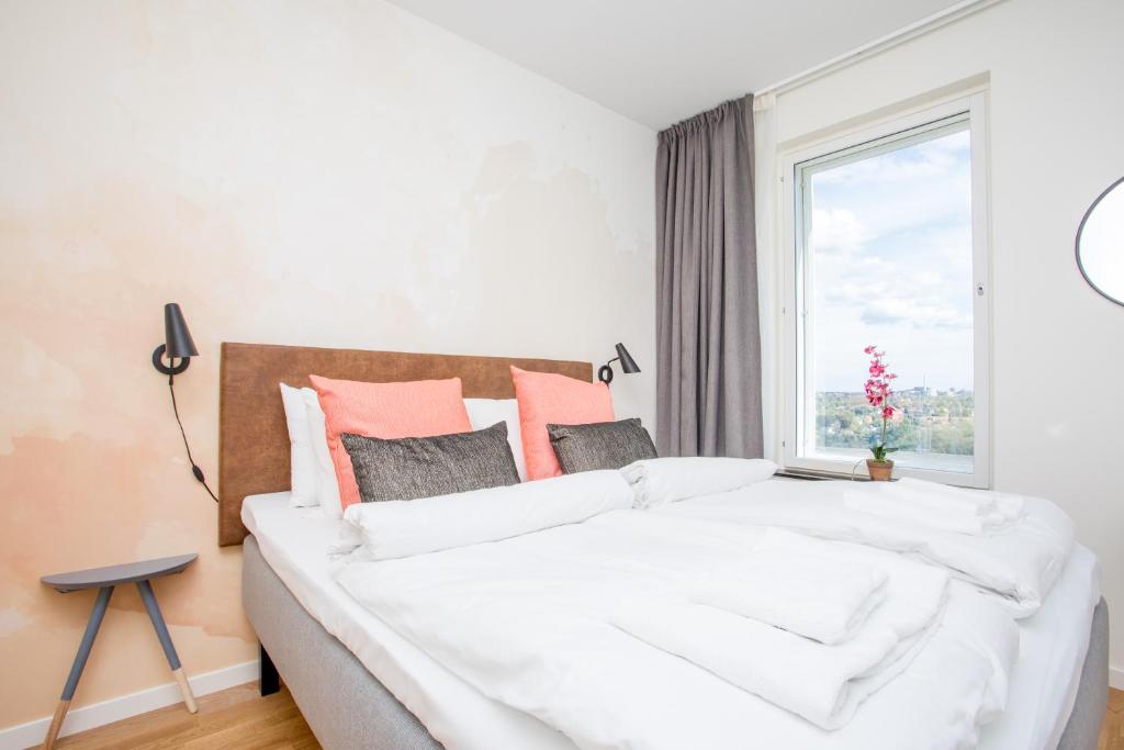 Postel nebo postele na pokoji v ubytování ApartDirect Älvsjö