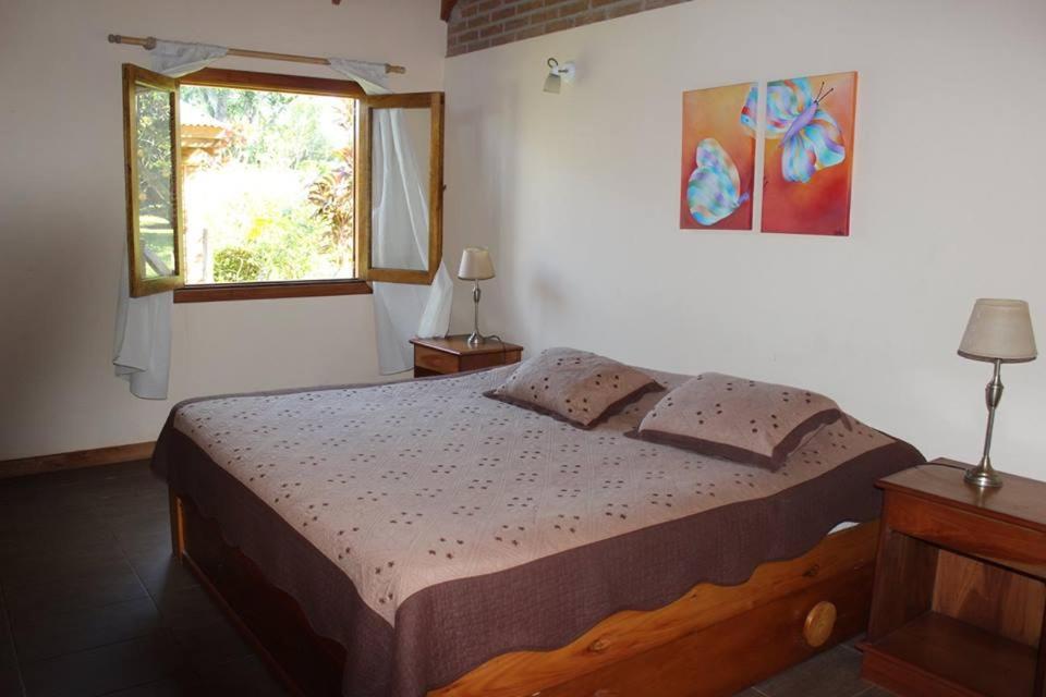A bed or beds in a room at Un Lugar Hotel Cabañas