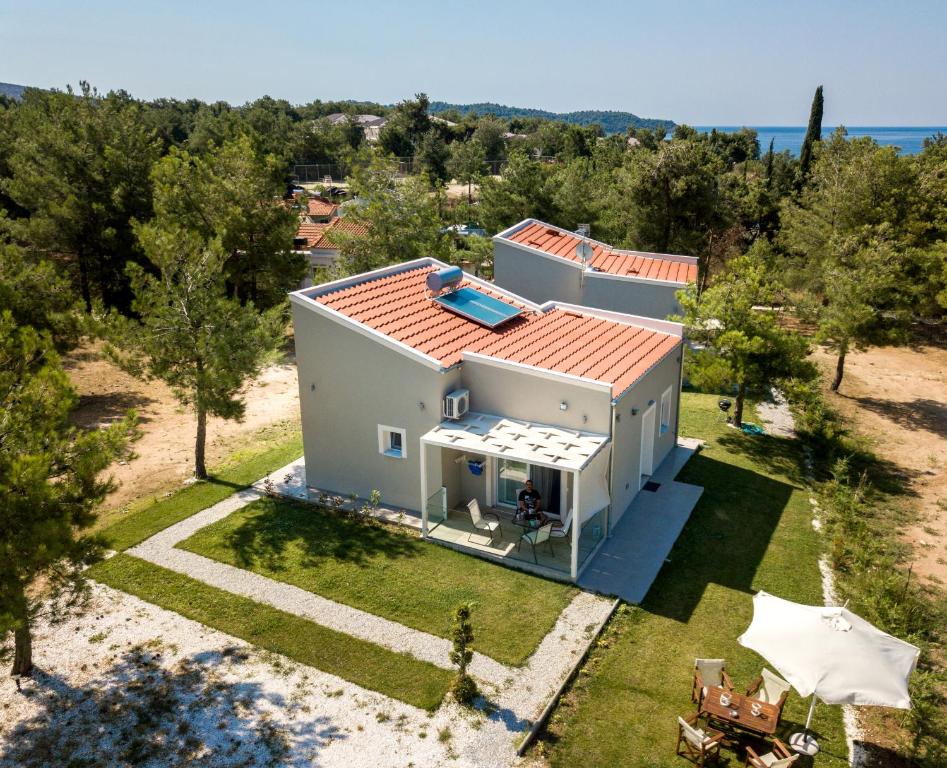 an aerial view of a house with a swimming pool at Venice Deluxe Studios in Pefkari