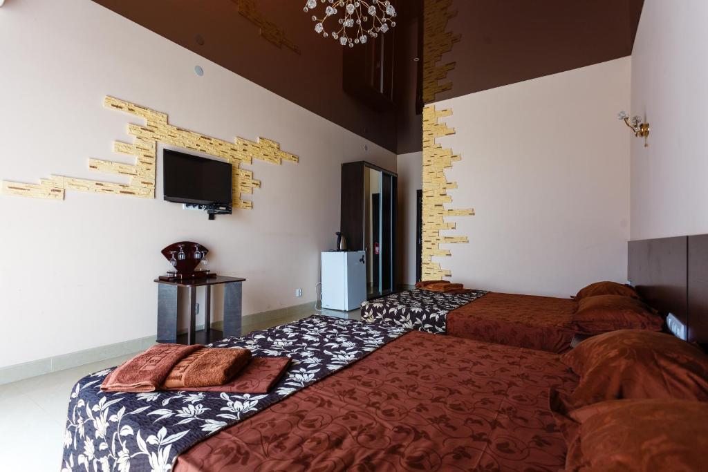 Postel nebo postele na pokoji v ubytování VIP Hotel