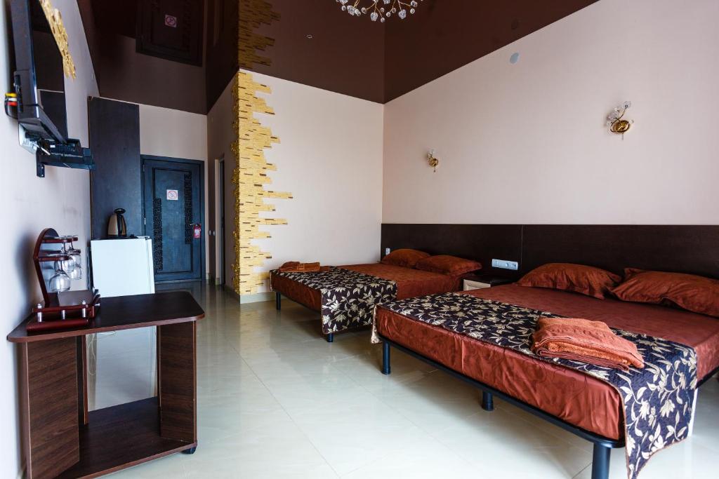 TV a/nebo společenská místnost v ubytování VIP Hotel
