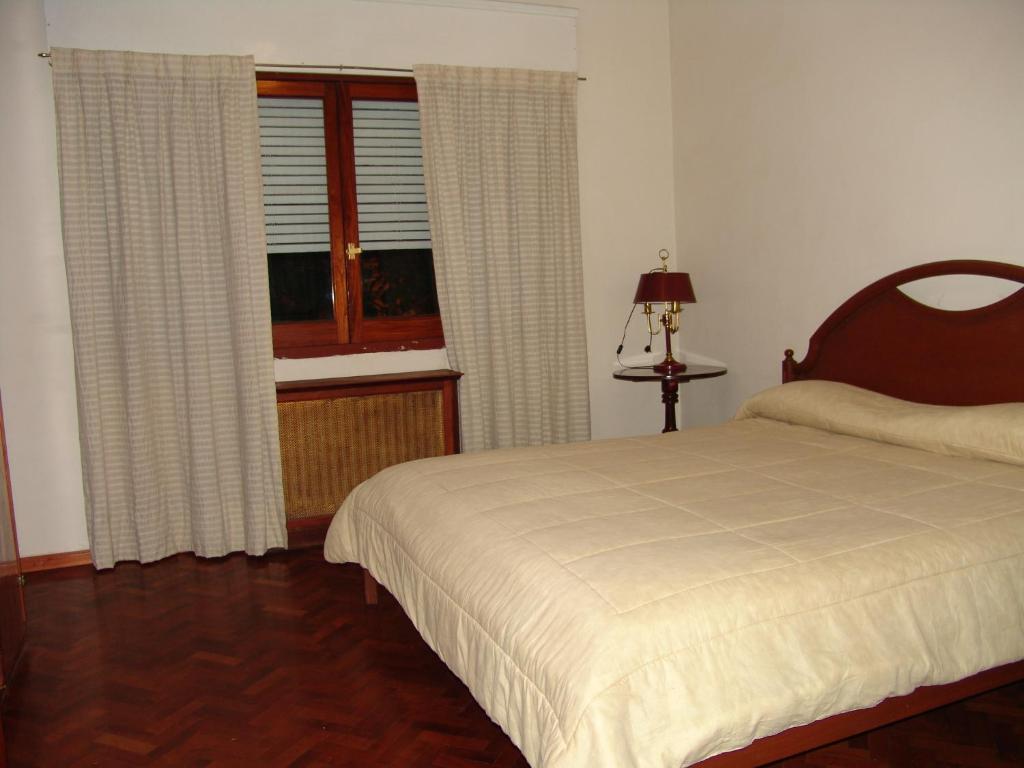 Cama o camas de una habitación en Alojarse en Mendoza B&B