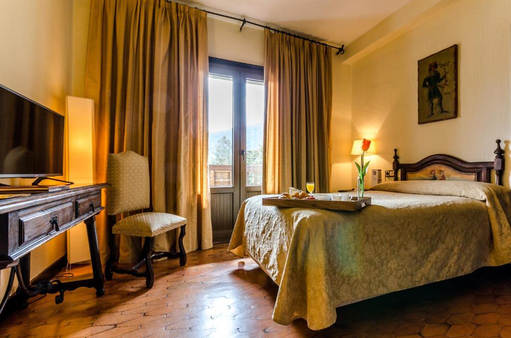 Posteľ alebo postele v izbe v ubytovaní Hotel Temple Ponferrada