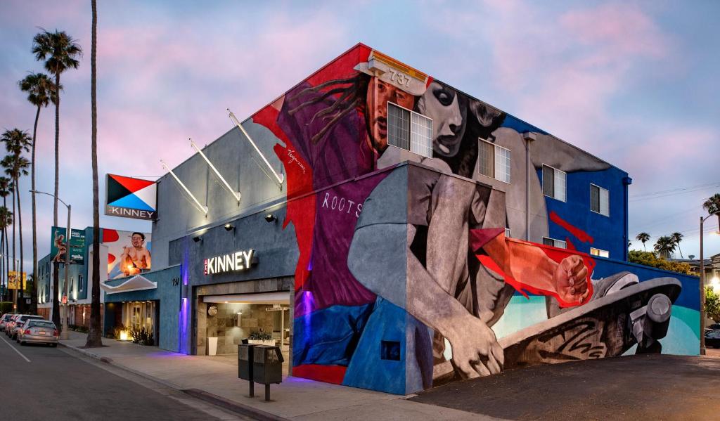 a building with a mural on the side of it at The Kinney - Venice Beach in Los Angeles