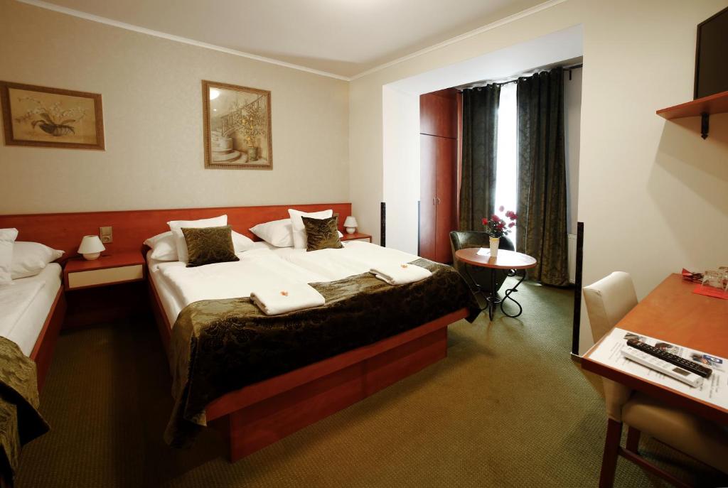 Postel nebo postele na pokoji v ubytování Hotel Roudna