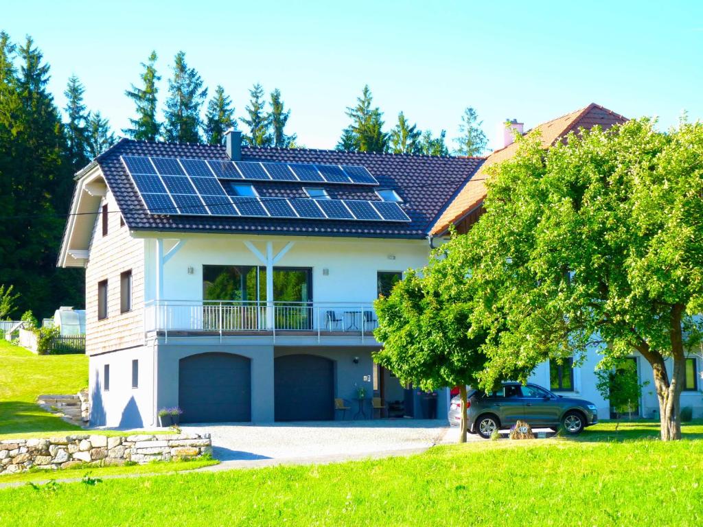 a house with solar panels on the roof at Ferienbauernhof Koller (Familie Hofer) - Urlaub am Bauernhof in Helfenberg