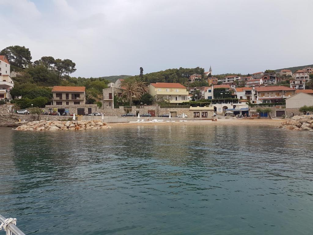a view of a town from the water with a beach at Villa Riva in Jelsa