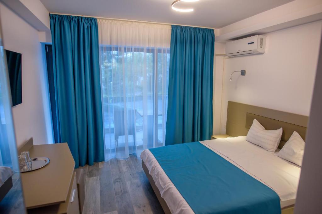 Postel nebo postele na pokoji v ubytování Belleview Suites