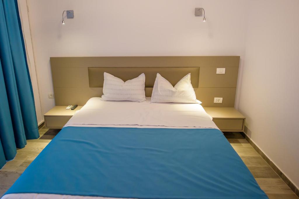 Postel nebo postele na pokoji v ubytování Belleview Suites