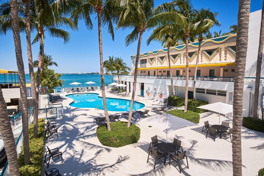 an aerial view of the resort with palm trees and a pool at Best Western On The Bay Inn & Marina in Miami Beach