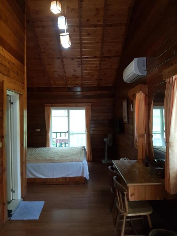 Postel nebo postele na pokoji v ubytování Jin Zu Cottage