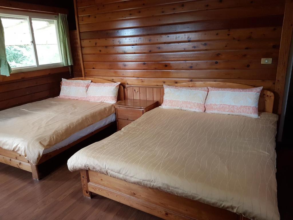 Postel nebo postele na pokoji v ubytování Jin Zu Cottage