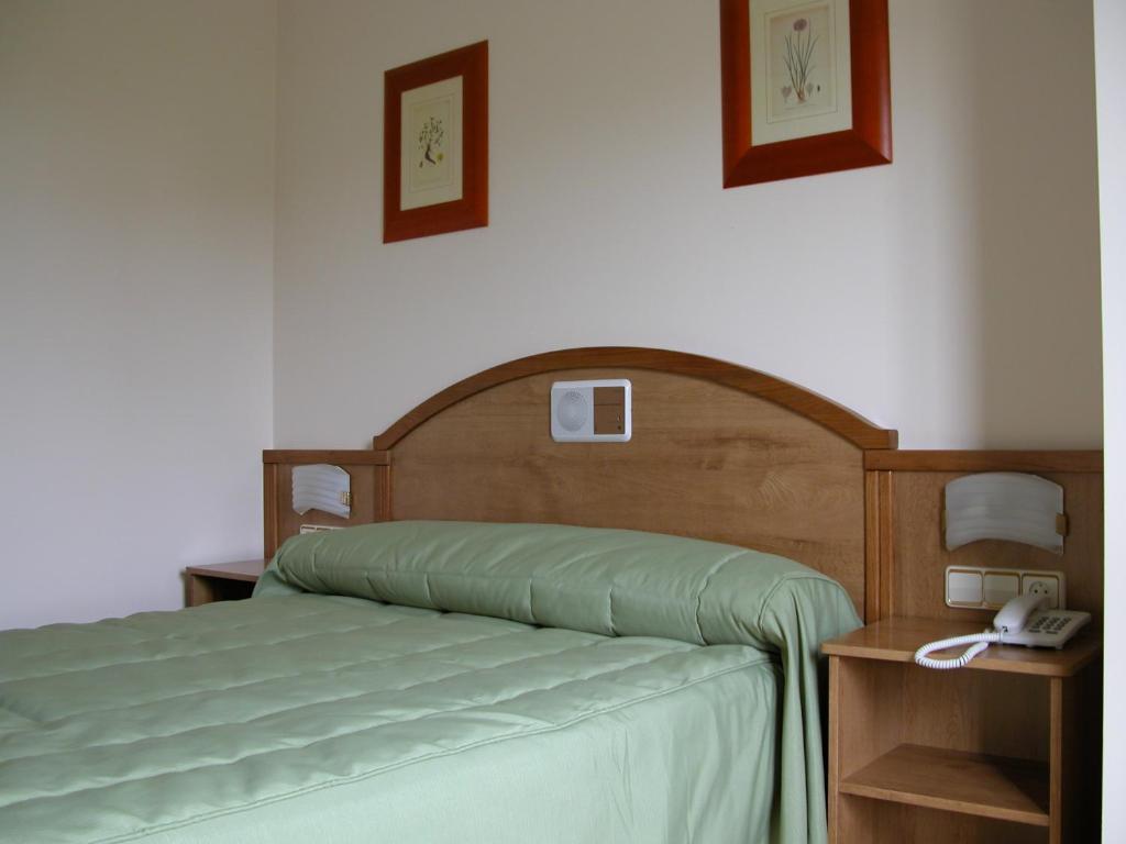 Ένα ή περισσότερα κρεβάτια σε δωμάτιο στο Hotel Costa Verde