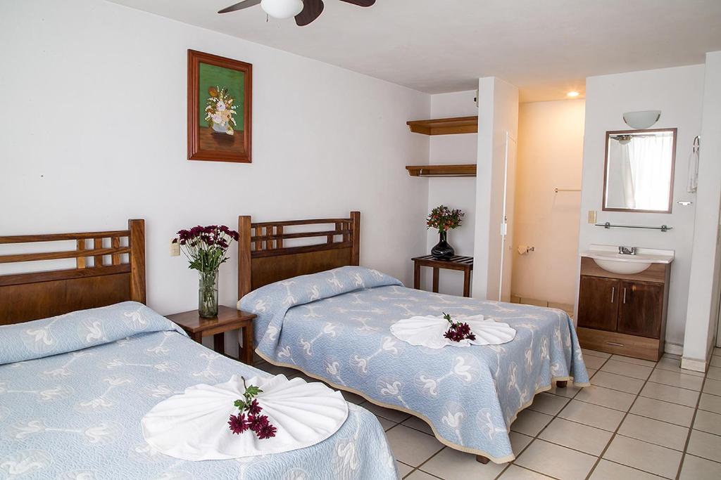 Postel nebo postele na pokoji v ubytování Vallartasol Hotel